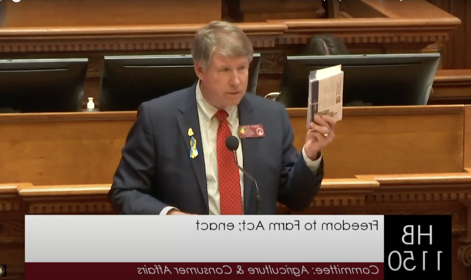 Chairman Robert Dickey presents House Bill 1150, the Freedom to Farm Act, to the House on Thursday. Chairman Dickey showed the support of GFB County Presidents who hand-wrote postcards